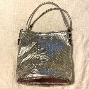 Metallic silver Brian Atwood adjustable bucket bag